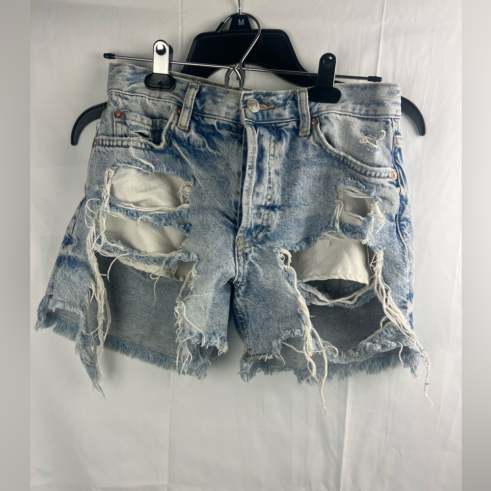 Blue ripped shorts